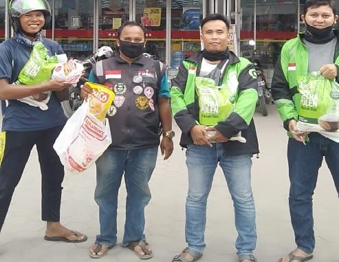 Mitra Gojek sedang menukarkan voucher di salah satu Alfamart di Siantar